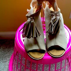 Only worn once. Cushioned real leather Toms high heels.